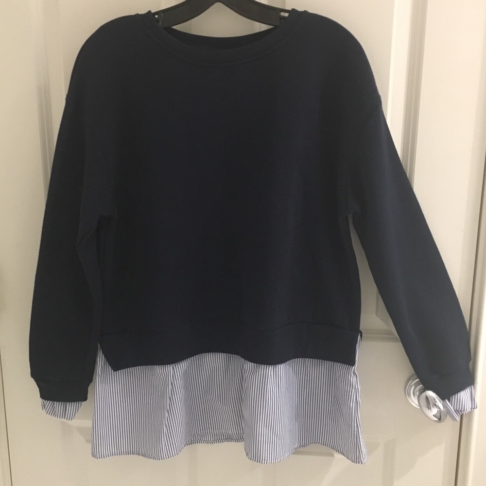 Navy sweater with design material